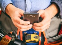 as135141712-builder-with-smartphone.jpeg