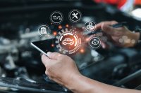 as511070208-Serviceman-working-on-car-motor-using-tablet.jpeg