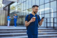 as967489426-smiling-male-nurse-smartphone.jpeg