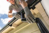 env-nf-worker-installing-gutter-system-on-roof-2024-06-03-20-06-18-utc.jpg
